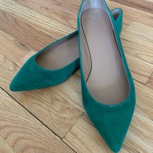 Green pointy flats